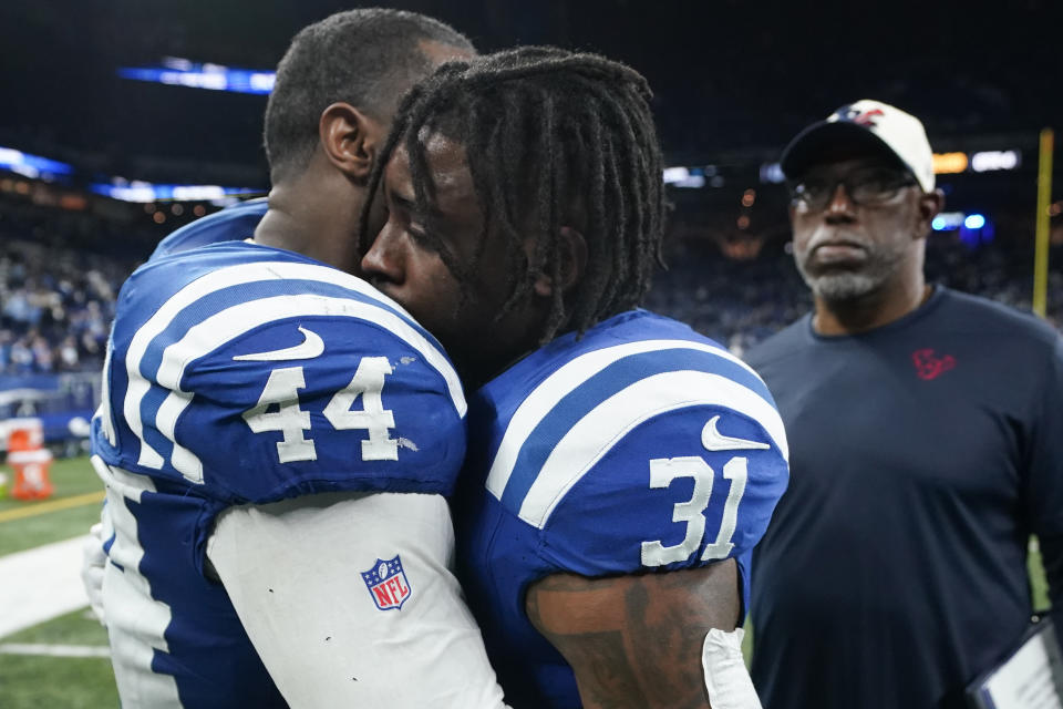 Indianapolis Colts linebacker Zaire Franklin (44) hugs running back Tyler Goodson (31) after a loss to the Houston Texans in an NFL football game Saturday, Jan. 6, 2024, in Indianapolis. (AP Photo/Darron Cummings)