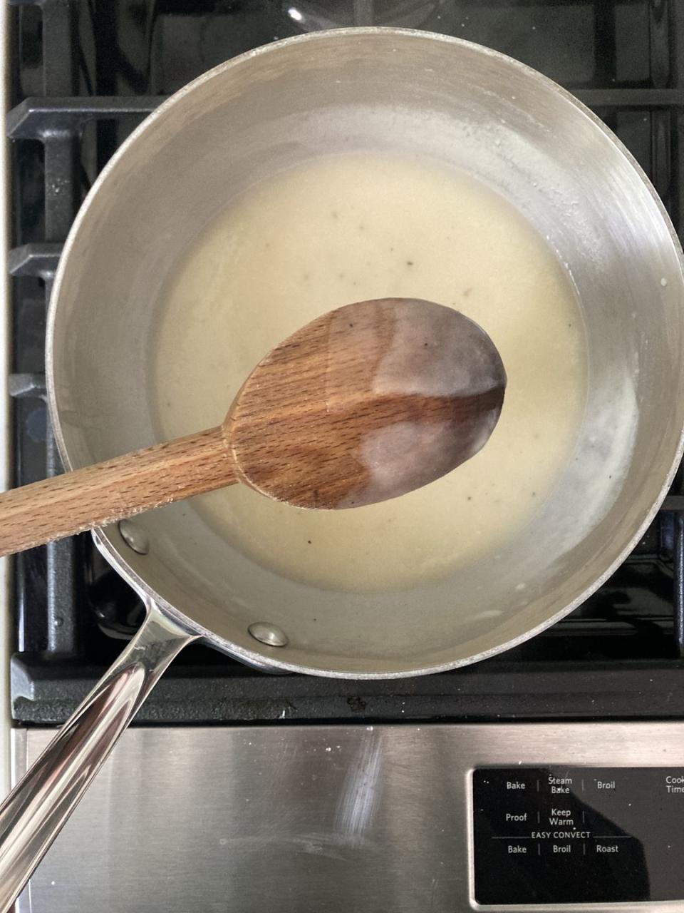 a pot with thickened chicken stock in it