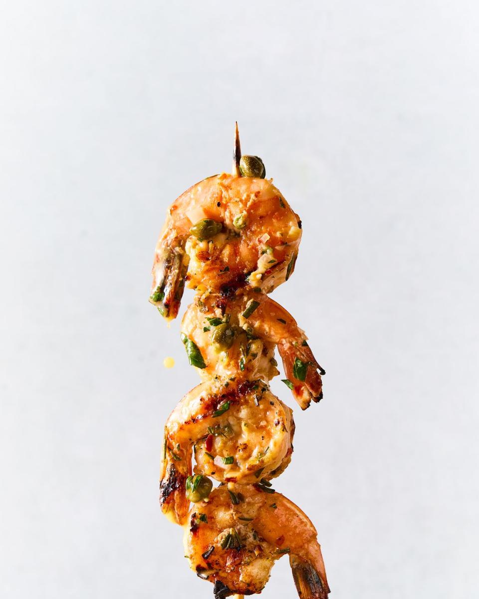 juicy, charred shrimp, bright lemon zest, briny capers, and a white wine butter sauce