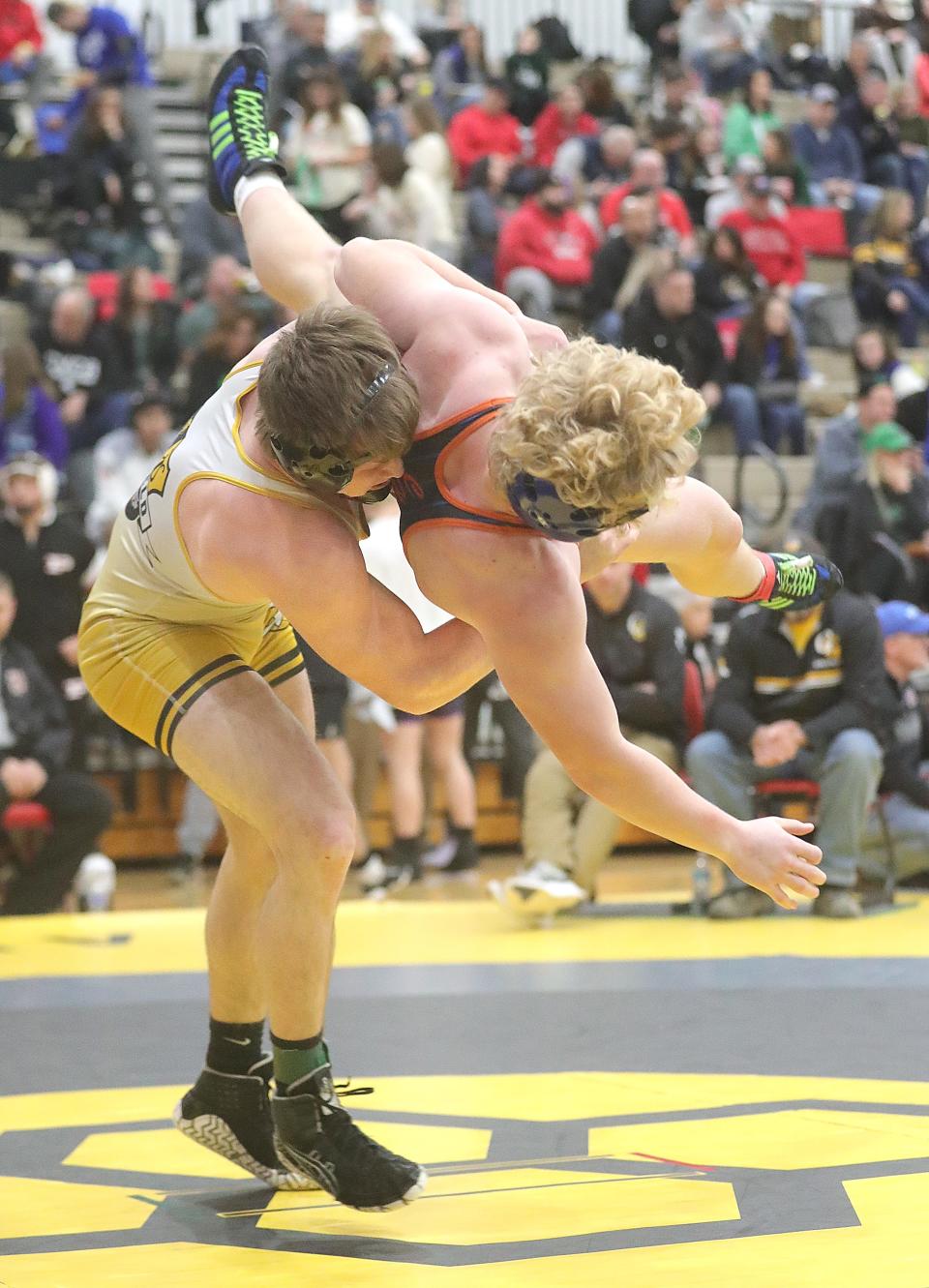 Garrettsville 190-pounder Keegan Sell, left, takes down Cy Finnen of Edison in the Brecksville Holiday Tournament, Friday, Dec. 29, 2023.