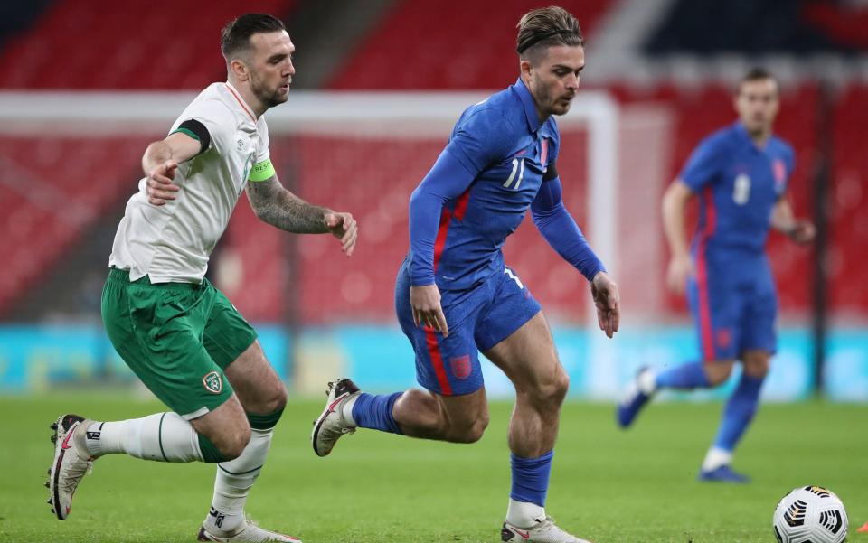 England's Jack Grealish, centre, gets past Ireland's Shane Duffy during the international friendly soccer match between England and Ireland at Wembley stadium in London, England, Thursday Nov. 12, 2020.  - AP