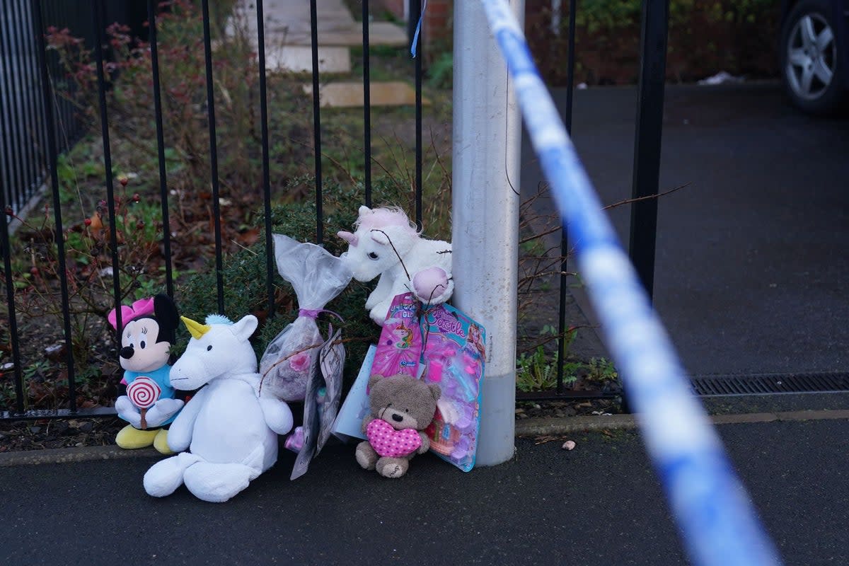 Soft toys and flowers left at the scene in Robin Close, Rowley Regis, in Sandwell (Jacob King/PA Wire)