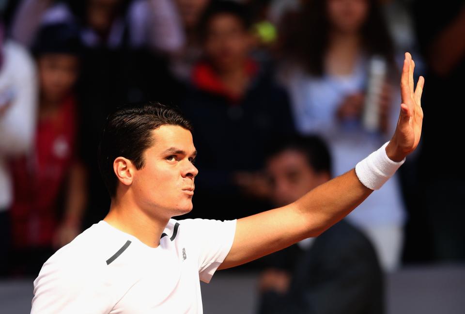 Raonic waves to the crowd after his straight sets victory Tuesday in Madrid. (Photo by Clive Brunskill/Getty Images)