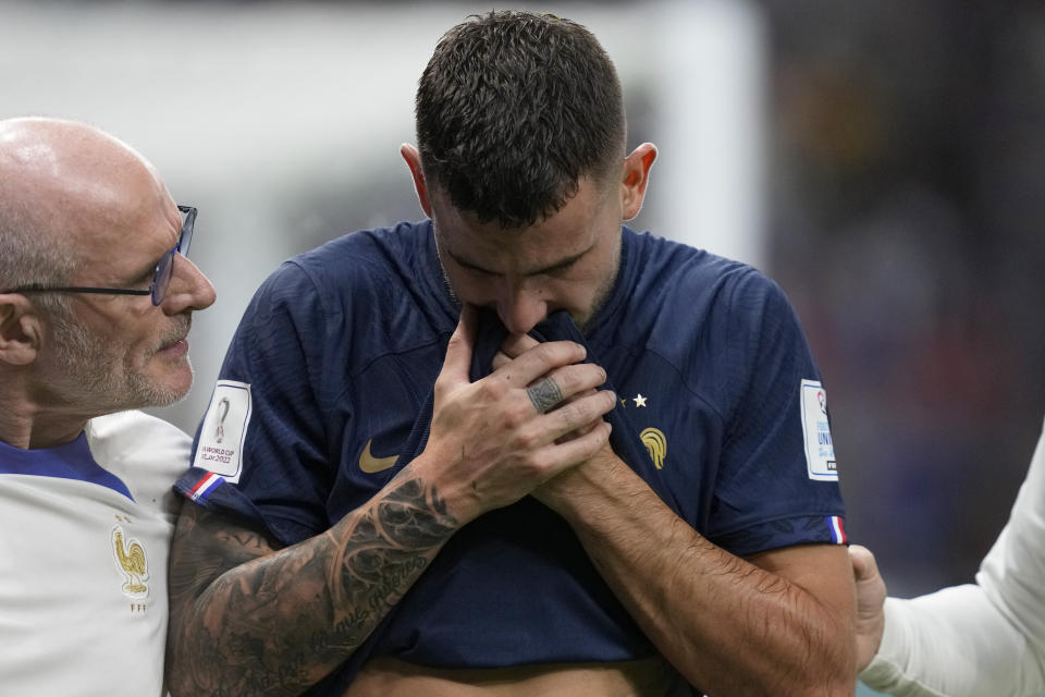 France's Lucas Hernandez leaves the pitch after getting injured during the World Cup group D soccer match between France and Australia, at the Al Janoub Stadium in Al Wakrah, Qatar, Tuesday, Nov. 22, 2022. (AP Photo/Thanassis Stavrakis)