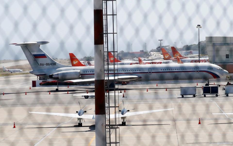 An airplane with the Russian flag is seen at Simon Bolivar International Airport in Caracas - REUTERS