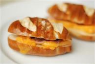 <div class="caption-credit"> Photo by: The Naptime Chef</div><b>Mini Ham & Cheese Pretzel Paninis</b> <br> <b><i>Ingredients:</i></b> <br> Small or large soft pretzels, cut in half <br> Mustard <br> Thinly sliced ham <br> Thinly sliced cheddar cheese <br> <b><i>Directions:</i></b> <br> 1. Slice the pretzels in half and spread a little bit of mustard on one side. <br> 2. Layer in ham and cheese and close the sandwich. <br> 3. Toast on a panini press or stovetop grill pan until the cheese is melted. Slice and serve!