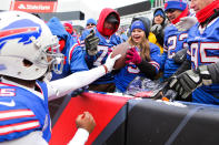 <p>Tyrod Taylor #5 of the Buffalo Bills gives the ball to a young fan after scoring a touchdown during the second quarter against Miami Dolphins on December 17, 2017 at New Era Field in Orchard Park, New York. (Photo by Brett Carlsen/Getty Images) </p>