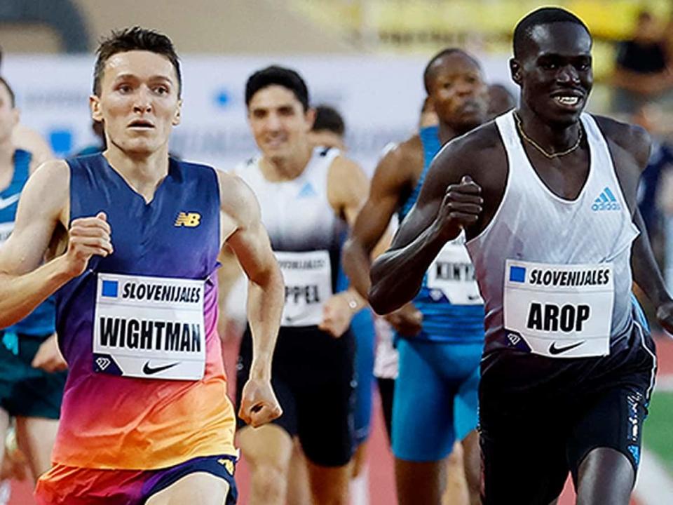 Jake Wightman of Great Britain edges Edmonton's Marco Arop at the finish line to win the men's 1,000 metres in a 2022 world-leading time of two minutes 13.88 seconds in Diamond League action at Stade Louis II on Wednesday in Monaco. Arop was second and set a Canadian record with his 2:14.35 performance. (Eric Gaillard/Reuters - image credit)