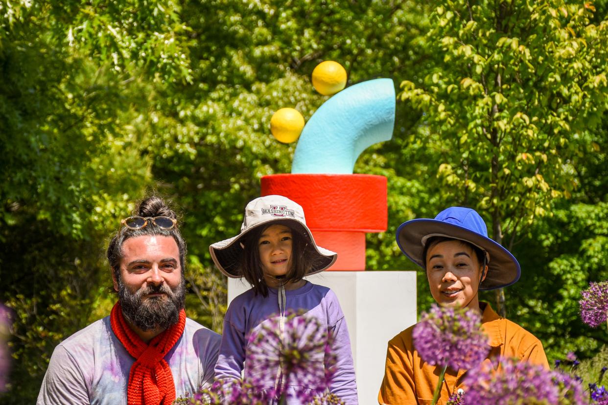 Artists Adam Frezza and Terri Chiao, with their daughter, Tove, at the New England Botanic Garden at Tower Hill