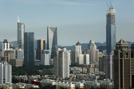 Commercial towers, including the 329-metre-high Hon Kwok City Center (R), which is under construction, are seen in Shenzhen, China August 3, 2015. REUTERS/Bobby Yip