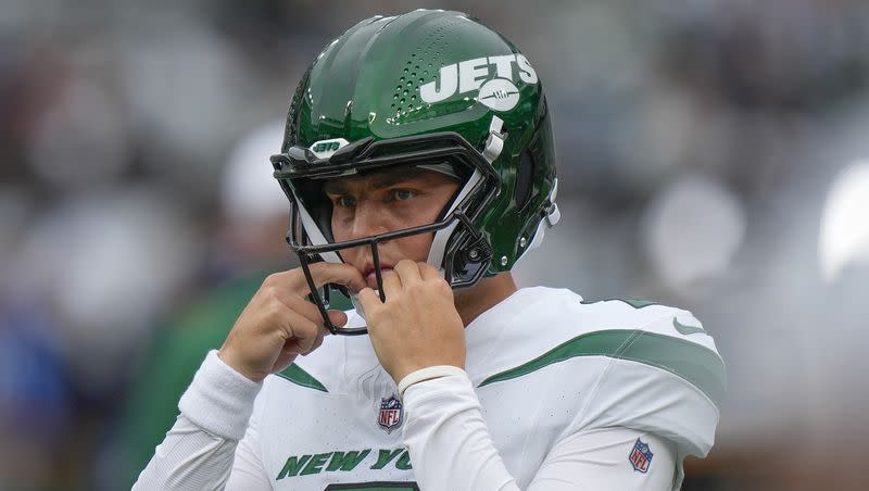 New York Jets quarterback Zach Wilson stands on the field before a game against the New England Patriots on Sunday Sept. 24, 2023, in New York. The former BYU star endured yet another rough outing in a loss to the Patriots and will face another even tougher test Sunday against Kansas City.