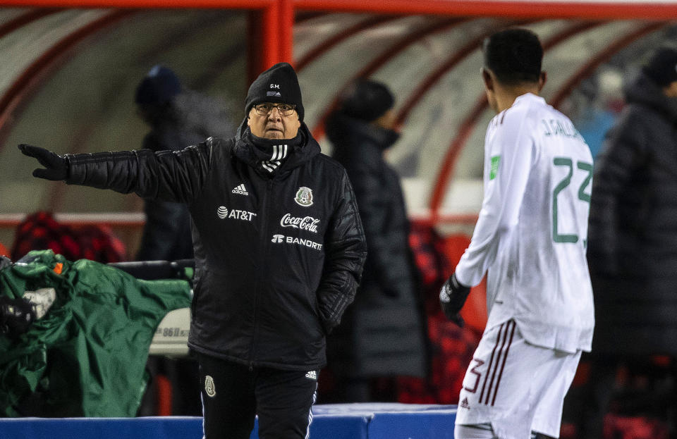 FILE - Mexico coach Gerardo "Tata" Martino directs his team during a FIFA World Cup qualifying soccer match against Canada, Tuesday, Nov. 16, 202, in Edmonton, Alberta. (Jason Franson/The Canadian Press via AP, File)