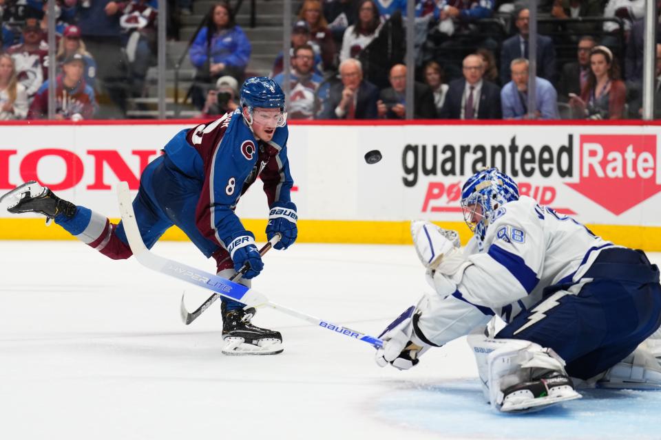 Colorado Avalanche defenseman Cale Makar (8) shoots against Tampa Bay Lightning goaltender Andrei Vasilevskiy (88) during the second period in Game 5 of the NHL hockey Stanley Cup Final, Friday, June 24, 2022, in Denver. (AP Photo/Jack Dempsey)