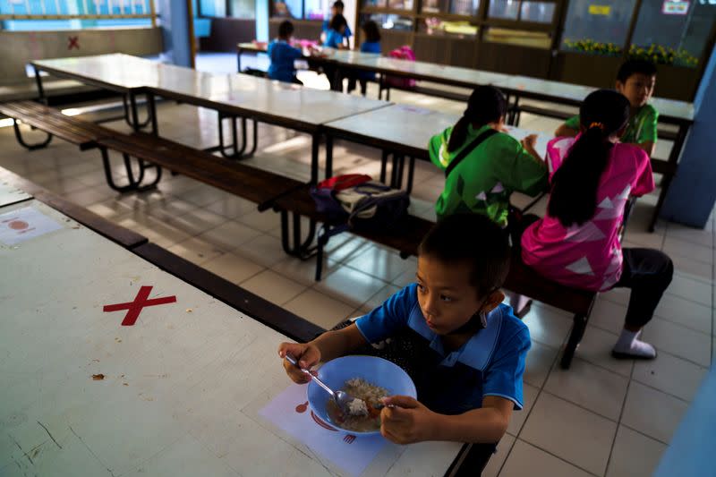 The Wider Image: Punching out of poverty: Despite risks, nine-year-old Thai fighter eager to return to ring