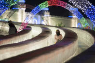 <p>Tourists visit illuminated ice sculptures at Ice and Snow World park on Jan. 4 in Harbin, China. (Photo: Tao Zhang/Getty Images) </p>