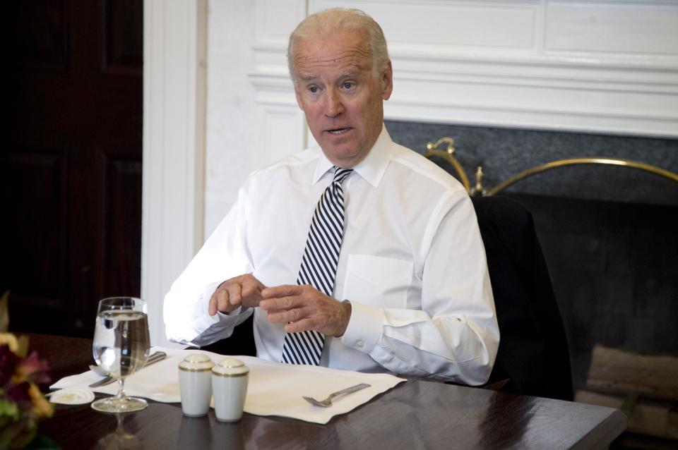 Vice President Joe Biden gestures as he speaks during a photo-op as he meets with President Barack Obama for lunch in the Private Dining Room of the White House in Washington, Wednesday, Jan. 8, 2014. (AP Photo/Carolyn Kaster)