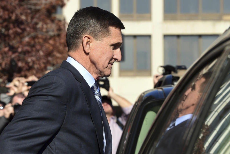 FILE - In this Dec. 1, 2017, file photo, former President Donald Trump national security adviser Michael Flynn leaves federal court in Washington. The Justice Department's dismissal of the Michael Flynn case has been swept up in a broader push by President Donald Trump and Republican allies to reframe the Russia investigation as a plot to sabotage his administration. (AP Photo/Susan Walsh, File)