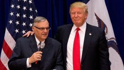 Joe Arpaio and Donald Trump appear at an Iowa campaign event in 2016.