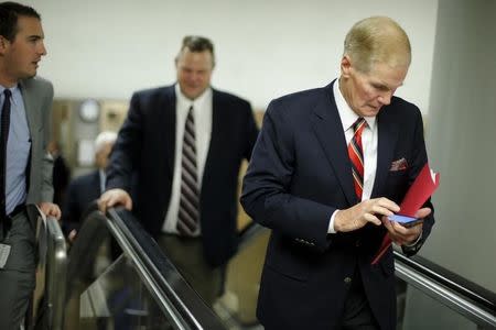 U.S. Senator Bill Nelson (D-FL) (R) arrives in the underground subway system for a vote at the U.S. Capitol in Washington May 14, 2015. REUTERS/Jonathan Ernst