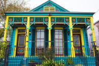 <p>A medley of vibrant shades highlight the Victorian architecture of this Louisiana home.</p>