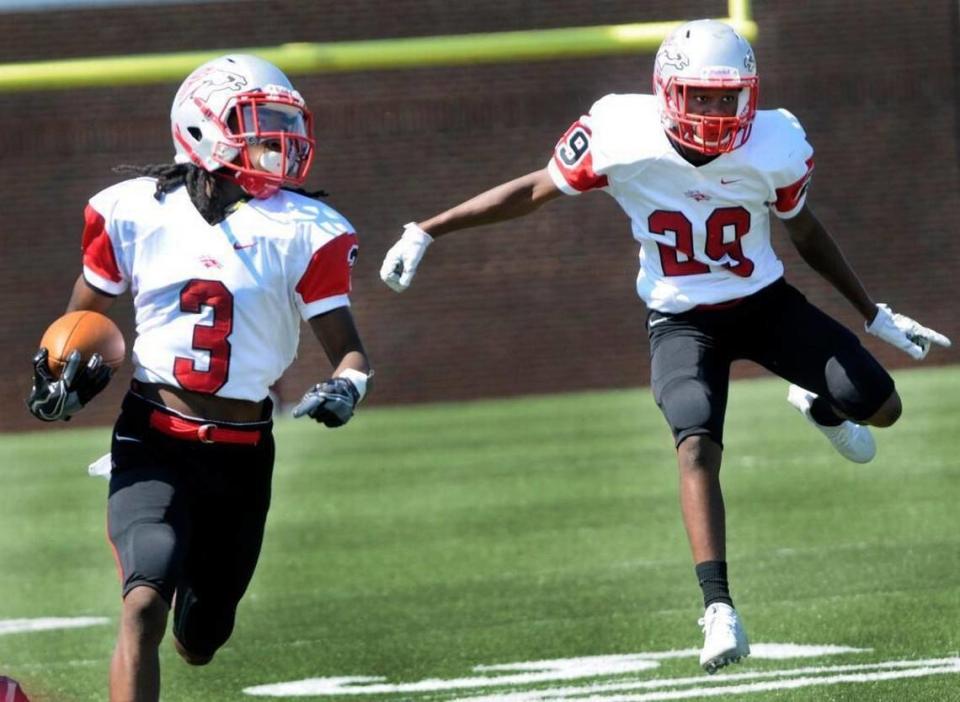 South Pointe’s Steven Gilmore Jr. runs with the ball as Deangelo Huskey follows during the Stallions’ win over Rock Hill on Sept. 2.