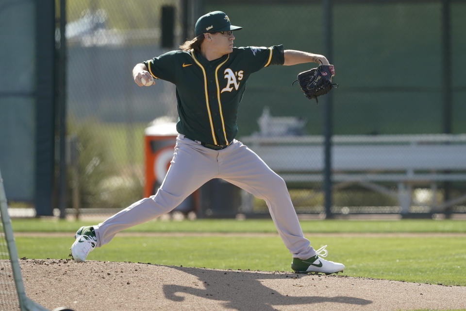 Oakland Athletics pitcher Montana DuRapau throws during a spring training baseball practice, Thursday, Feb. 25, 2021, in Mesa, Ariz. (AP Photo/Matt York)