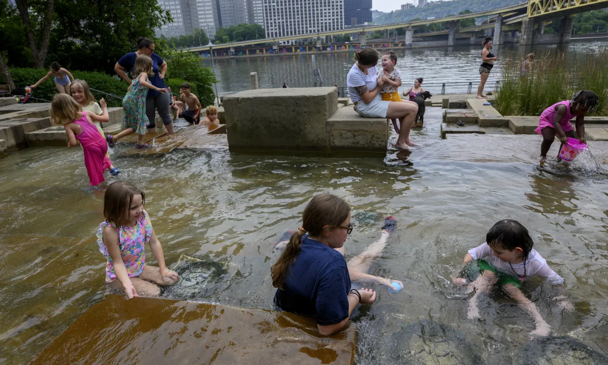 Pittsburghers flock to the Water Steps at the Riverfront Park along the Allegheny River