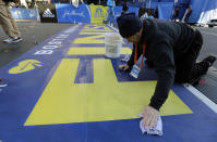 Anthony Bisenti cleans the finish line before the running of the 118th Boston Marathon Monday, April 21, 2014 in Boston. (AP Photo/Robert F. Bukaty)