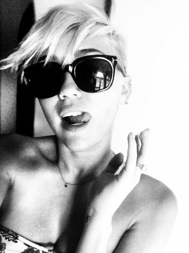 Celebrity photos: Miley Cyrus tweeted this gorgeous black and white photo of herself wearing a pair of very cool shades. She posted it alongside the caption: “Love my new Tom Ford sunnies my boooo got me.”