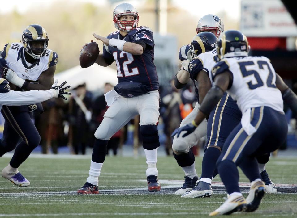 Passing 'em by: Tom Brady is now alone as the winningest quarterback in NFL history. (AP)