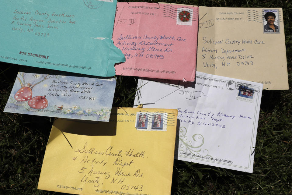 In this Monday, June 8, 2020, photo, pen pal letters are displayed outside the Sullivan County Health Care nursing home in Unity, N.H. In a letter-writing effort during the virus pandemic to connect nursing home residents in two neighboring communities, residents now are receiving pen pal letters from across the United States. (AP Photo/Charles Krupa)