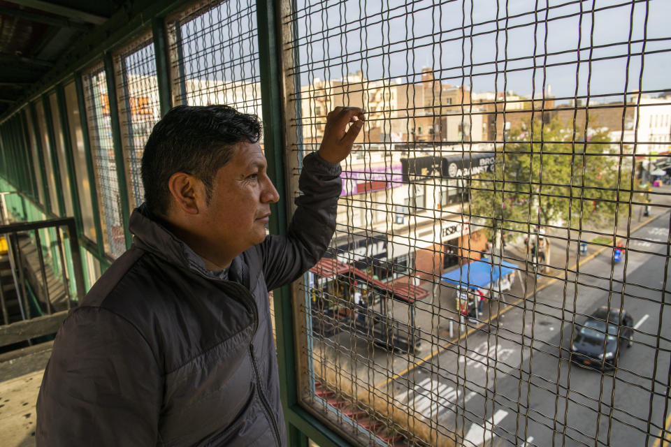 Ecuadorian immigrant Neptali Chiluisa looks at outside a train station in the borough of Bronx on Monday, Oct. 25, 2021, in New York. Chiluisa, who crossed the border in June in Arizona and was detained for a week with his 14-year-old son, acknowledges coming for economic reasons and wonders if he has any options for temporary legal status. (AP Photo/Eduardo Munoz Alvarez)