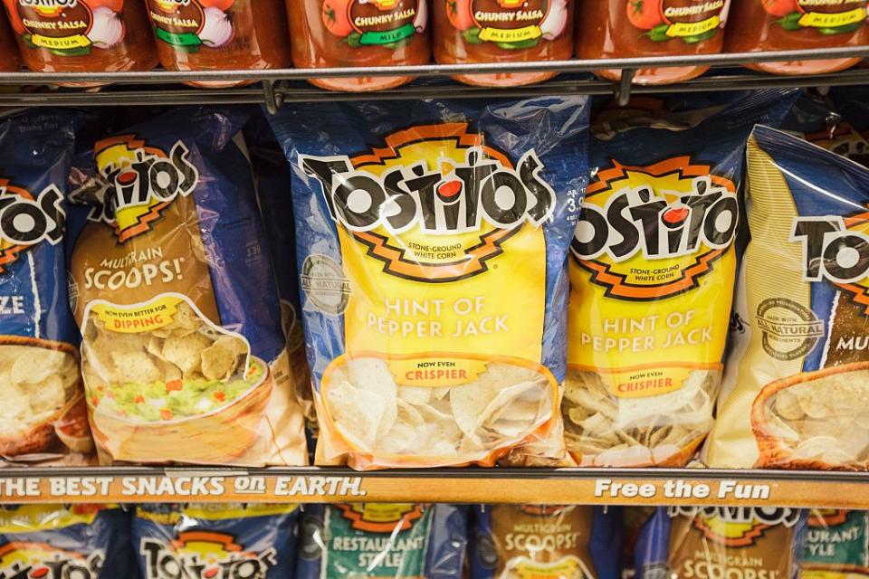 Tostitos has two guys dipping a chip in its logo