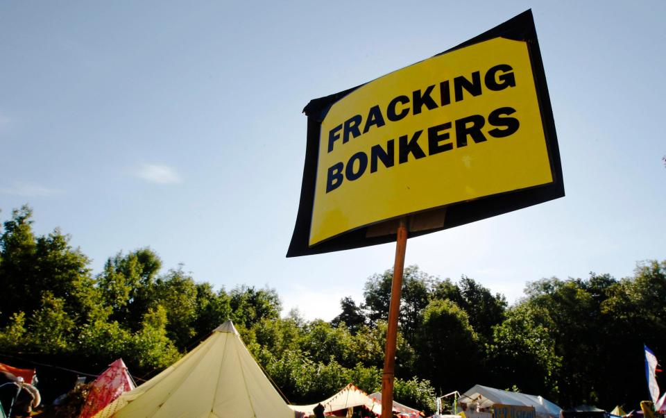 An anti-fracking sign is displayed at the protest camp by the entrance to a site run by Cuadrilla Resources - LUKE MACGREGOR 