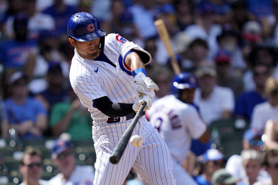 Chicago Cubs' Seiya Suzuki hits an RBI double off San Francisco Giants starting pitcher Logan Webb during the seventh inning of a baseball game Monday, Sept. 4, 2023, in Chicago. (AP Photo/Charles Rex Arbogast)