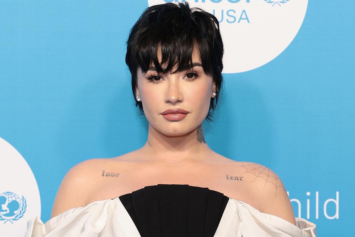 Demi Lovato Shines in Elegant Off-the-Shoulder Gown that Showcases Her 'Love' and 'Fear' Tattoos