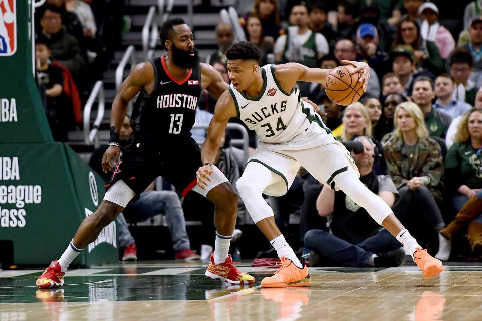 MILWAUKEE, WISCONSIN - MARCH 26:  Giannis Antetokounmpo #34 of the Milwaukee Bucks is defended by James Harden #13 of the Houston Rockets during the second half of a game at Fiserv Forum on March 26, 2019 in Milwaukee, Wisconsin. NOTE TO USER: User expressly acknowledges and agrees that, by downloading and or using this photograph, User is consenting to the terms and conditions of the Getty Images License Agreement. (Photo by Stacy Revere/Getty Images)