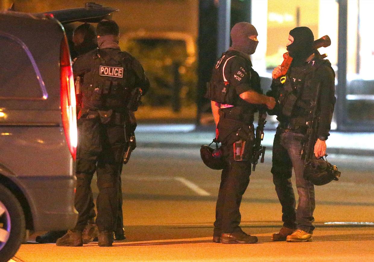 Armed police at the scene of the bowling alley where a gunman took people hostage: PA