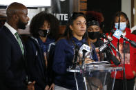 Tamala Payne, center, mother of Casey Goodson Jr., speaks during a news conference Thursday, Dec. 2, 2021, in Columbus, Ohio about the indictment of a former deputy who shot and killed her son. Jason Mead, the Ohio sheriff's deputy who fatally shot Casey Goodson Jr. in the back five times has been charged with murder and reckless homicide. (AP Photo/Jay LaPrete)