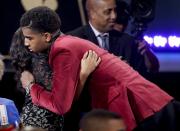 <p>Marquese Chriss hugs a supporter after being selected eighth overall by the Sacramento Kings during the NBA basketball draft, Thursday, June 23, 2016, in New York. (AP Photo/Frank Franklin II) </p>