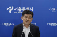 Seoul Metropolitan Government spokesperson Hwang In-sik speaks to the media at Seoul City Hall in Seoul, South Korea, Wednesday, July 15, 2020. The city government of the South Korean capital, Seoul, said Wednesday it will launch an investigation into allegations of sexual misconduct surrounding late Mayor Park Won-soon, who was found dead after one of his secretaries filed a complaint claiming yearslong abuse. (AP Photo/Lee Jin-man)