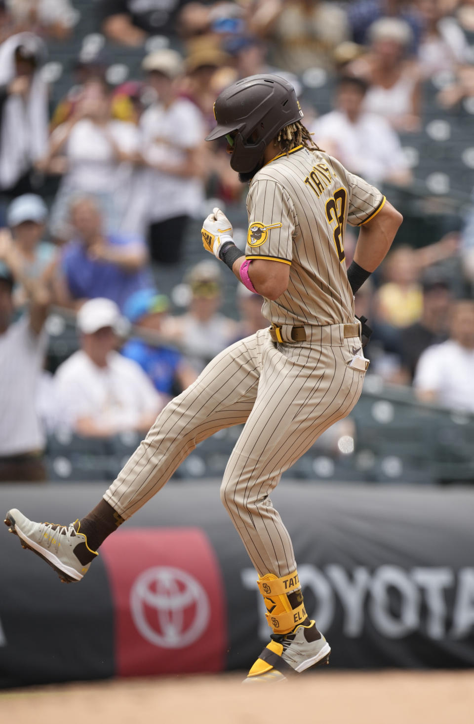 San Diego Padres' Fernando Tatis Jr., stops to make a jump before third base as he circles the bases after hitting a solo home run in the third inning of a baseball game Wednesday, June 16, 2021, in Denver. (AP Photo/David Zalubowski)