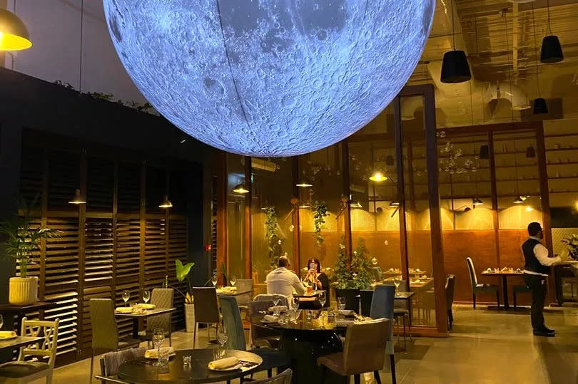 Lunar Restaurant at the World of Wedgwood is a new fine dining venue where diners eat under a huge moon sculpture -Credit:MEN