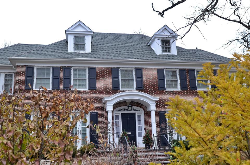 A red brick three-story home