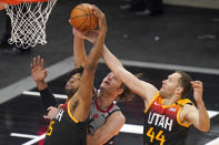 Washington Wizards center Robin Lopez, center, battle for a rebound against Utah Jazz's Derrick Favors (15) and Bojan Bogdanovic (44) in the first half during an NBA basketball game Monday, April 12, 2021, in Salt Lake City. (AP Photo/Rick Bowmer)