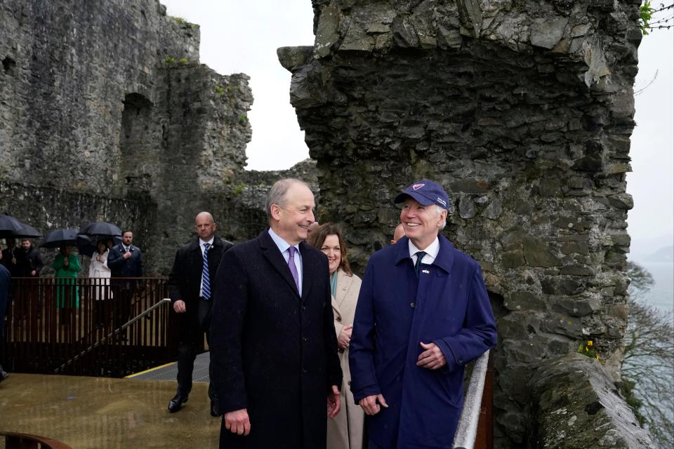 Micheál Martin, Tánaiste of Ireland, left, and President Joe Biden tour Carlingford Castle in County Louth, Ireland, Wednesday, April 12, 2023.