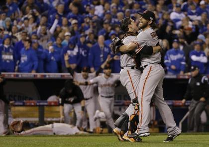 Madison Bumgarner and Buster Posey embrace after the final out of the World Series. (AP)