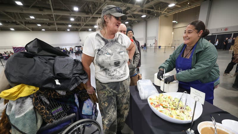 Tonya Larsen chats with volunteer Elia Flores while in line for food at the Larry H. Miller Company and Larry H. and Gail Miller Family Foundation’s annual Season of Thanksgiving Dinner and Service Event at the Salt Palace Convention Center in Salt Lake City on Monday, Nov. 20, 2023. Volunteering can increase our sense of purpose, which is part of human flourishing, experts in the field say.