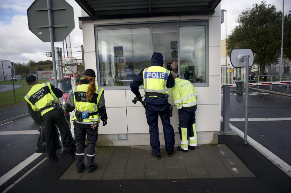 Police on the scene after several the scene after several Greenpeace activists conducted what the organization called a ‘stress test’ of the security at the nuclear power plant in Ringhals on the Swedish west coast Tuesday Oct. 9, 2012. Swedish nuclear power officials say that police have arrested dozens of environmental activists who climbed fences to breach the outer perimeter of two atomic plants. (AP Photo/Bjorn Larsson Rosvall / SCANPIX ) SWEDEN OUT