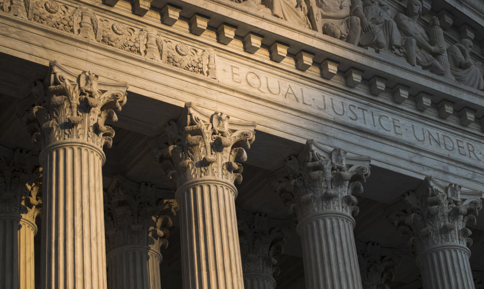 FILE - The Supreme Court in Washington is seen at sunset on Oct. 10, 2017. In a monthslong inquiry, which included reviewing tens of thousands of pages of documents from more than 100 public records requests, The Associated Press has examined what happens behind the scenes when Supreme Court justices travel to colleges and universities for lectures and other events. The AP learned the identities of donors and politicians invited to events with justices, details about the perks that have accompanied the school visits and information about how school trips have helped advance books sales. (AP Photo/J. Scott Applewhite, File)